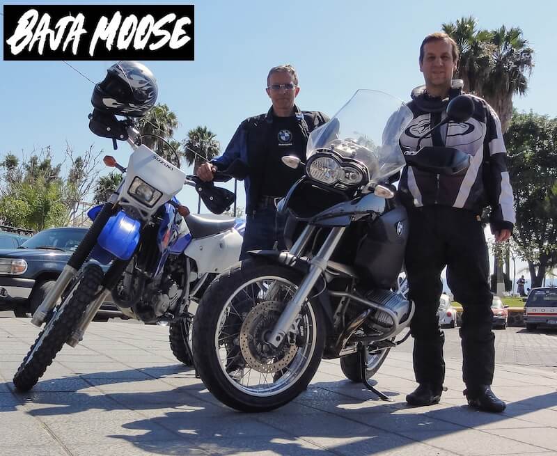 Two men in Chapala Mexico in riding gear standing next to a BMW motorcycle and a Suzuki DRZ400 dual sport bike